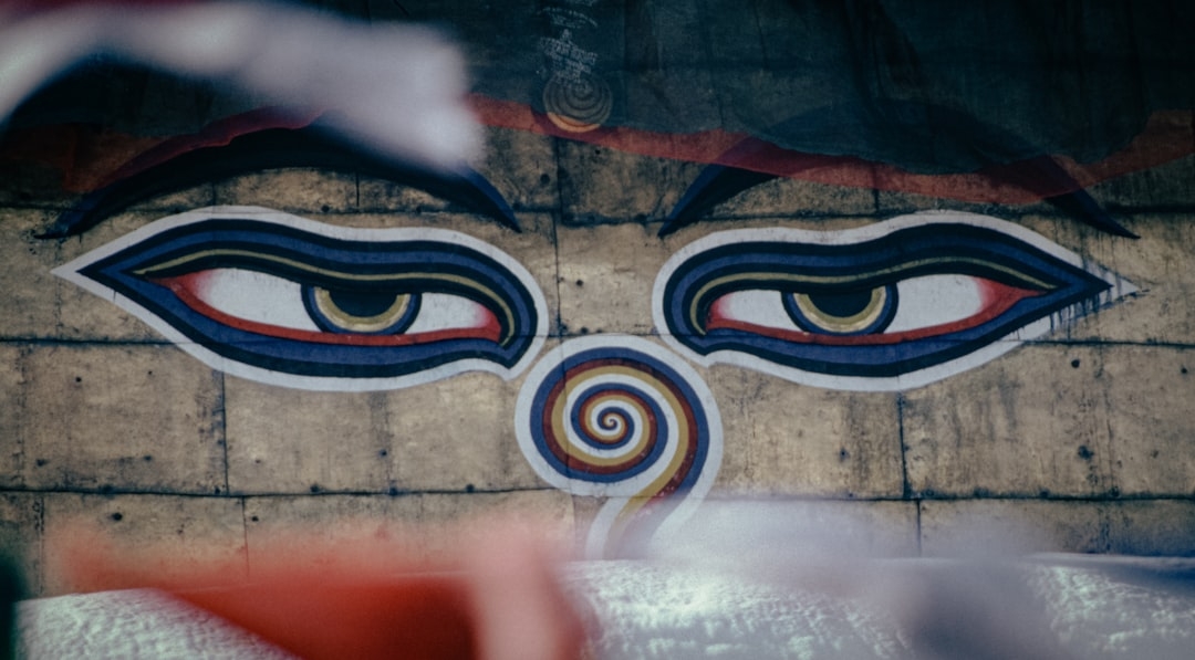 a close up of a face painted on the side of a building