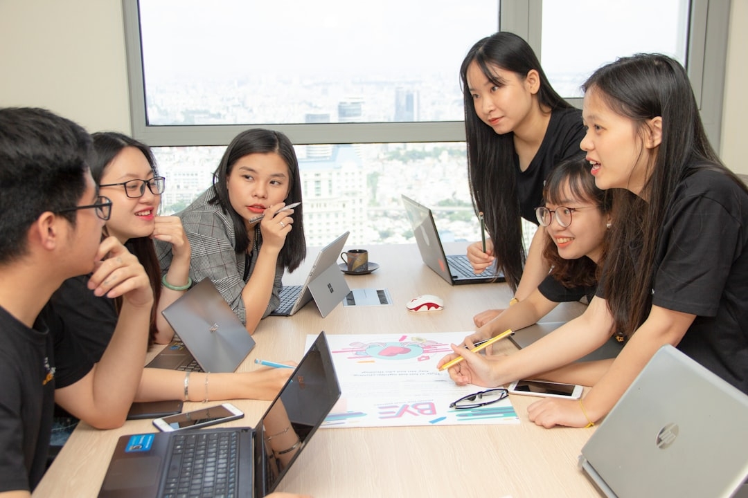 group of people with laptops