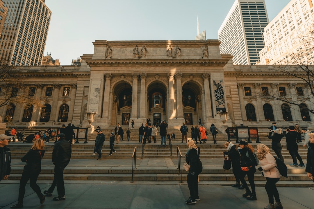 people walking near New York Public library during daytime