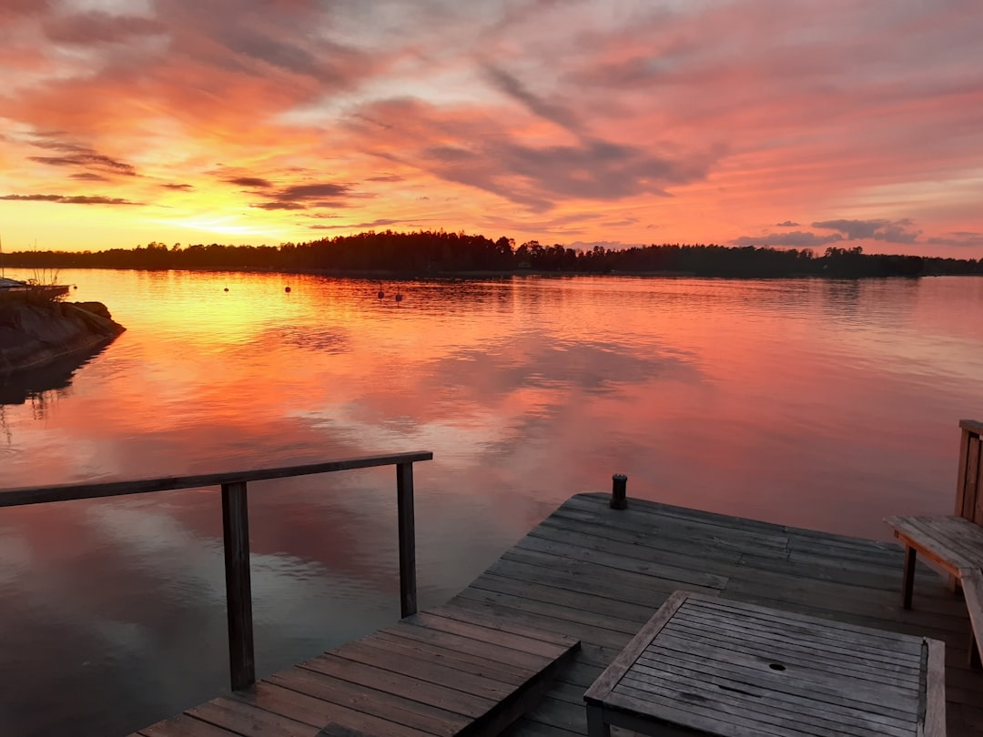 a wooden dock sitting on top of a body of water