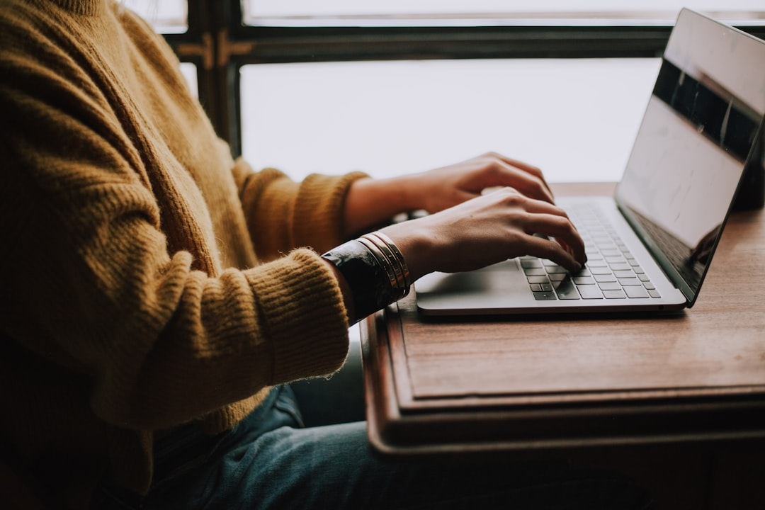 Person sitting front of laptop