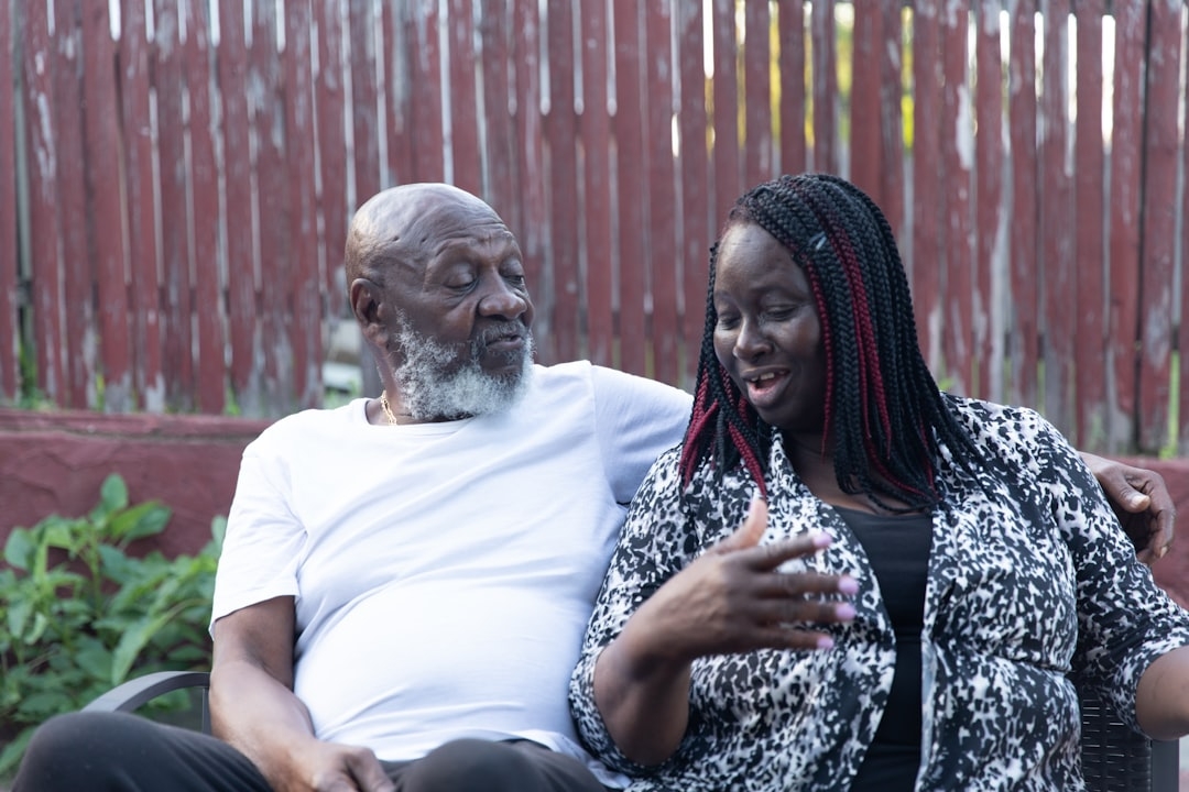 A man and woman sitting on a bench