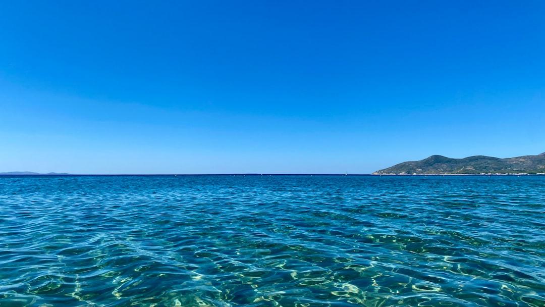 a body of water with islands in the distance